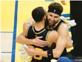  ?? JOHN HEFTI/AP ?? Warriors guard Klay Thompson, right, hugs Stephen Curry after beating the Mavericks in Game 5 of the Western Conference finals Thursday in San Francisco.