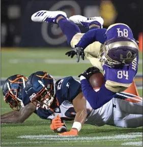  ?? File photo/AP ?? Atlanta Legends receiver Bug Howard (84) is tackled by Orlando Apollos safety Will Hill and defensive back Keith Reaser (29) after catching a pass during the first half of an Alliance of American Football game, in Orlando, Fla., on Feb. 9.