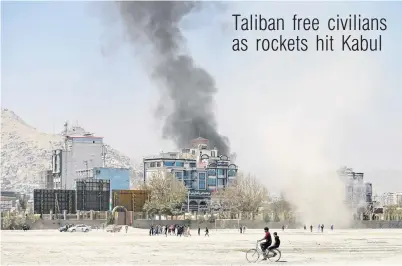  ?? PHOTO: REUTERS ?? Rocket assault . . . Smoke rises from the site of an attack in Kabul yesterday.