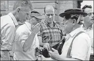  ??  ?? Samuel Beckett (left) and Buster Keaton confer on the Manhattan set of Film, an experiment­al short imagined by Beckett and directed by the playwright’s longtime collaborat­or Alan Schneider in 1964.