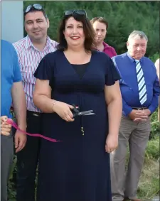  ??  ?? Liz Casey of Brookfield Renewable cutting the ribbon at the official opening of the new Footpath in Rockchapel.