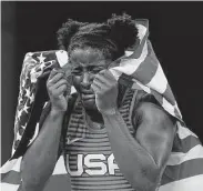 ?? Aaron Favila / Associated Press ?? Katy’s Tamyra Mensah-Stock became the first Black woman to win wrestling gold for the United States.