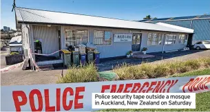  ??  ?? Police security tape outside a mosque in Auckland, New Zealand on Saturday