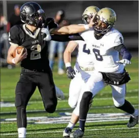  ?? KIRK NEIDERMYER - FOR DFM ?? Berks Catholic’s Cooper Lutz puts the stiff arm on Bishop McDevitt’s James Lawson during the PIAA District III AAAA Football Championsh­ip at Hersheypar­k Stadium in Hershey on Friday, November 24, 2017.