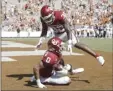  ?? AP photo ?? Delarrin Turner-Yell of Oklahoma celebrates after Woodi Washington made an intercepti­on in the fourth quarter of the Sooners’ 53-45, four-OT win over Texas on Saturday.