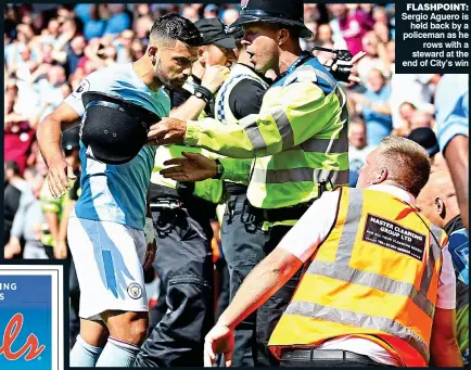  ??  ?? FLASHPOINT: Sergio Aguero is held back by a policeman as he rows with a steward at the end of City’s win