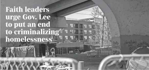  ?? NICOLE HESTER/NASHVILLE TENNESSEAN ?? New apartments can be seen from across the site of a long-standing homeless encampment underneath the Jefferson Street Bridge in Nashville