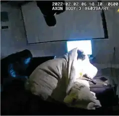  ?? MINNEAPOLI­S POLICE DEPARTMENT VIA AP ?? A Minneapoli­s police bodycam image shows Amir Locke in a blanket on a couch holding a gun moments before he was fatally shot by police as they executed a search warrant Wednesday.