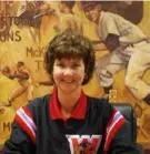  ?? Sports Facility LLC ?? Washington Wild Things CEO Christine Blaine in front of a baseball mural by Dino Guarino, who also designed the Wild Things logo.