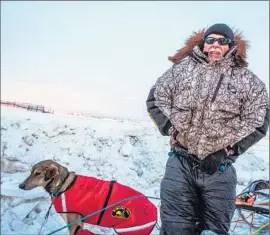  ?? Photog r aphs by Loren Holmes
Alaska Dispatch News ?? JEFF KING, a four- time Iditarod champion, is shown during last year’s race. One of his dogs was killed in a snowmobile collision and two were seriously hurt.