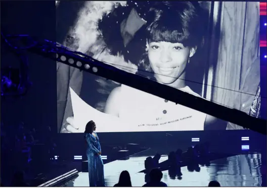  ?? MARK HUMPHREY — THE ASSOCIATED PRESS ?? Mickey Guyton presents the Equal Play award at the CMT Music Awards on June 9, 2021, in Nashville, Tenn. Pictured on screen is the winner, Linda Martell.