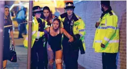  ??  ?? Blast horror: Injured victims at the Ariana Grande, inset, gig