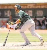  ?? Scott Strazzante / The Chronicle ?? The A’s Chad Pinder hits one of his two singles during Sunday’s simulated game at the Coliseum. He homered in a simulated game Saturday.
