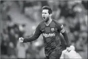  ?? ASSOCIATED PRESS ?? IN THIS FEB. 22 FILE PHOTO, Barcelona’s Lionel Messi celebrates after scoring his side’s opening goal during a Spanish La Liga soccer match between Barcelona and Eibar at the Camp Nou stadium in Barcelona, Spain.