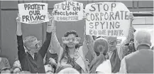  ?? Olivier Douliery / TNS ?? Code Pink activists protest before Facebook CEO Mark Zuckerberg’s testimony last week in Washington.