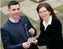  ??  ?? Shelley Harris of Signify, Ireland, presents the sports manager of the month award for February to Ireland U-20 rugby coach Noel McNamara after his side won the Triple Crown