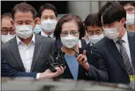  ?? (AP/Ahn Young-joon) ?? Lee Myung-hee leaves the Seoul Central District Court in South Korea after her sentencing Tuesday.