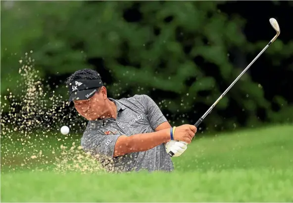  ??  ?? K J Choi is a study in concentrat­ion as he plays a bunker shot during the 2017 Canadian Open.