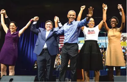  ?? ASHLEE REZIN/SUN-TIMES ?? Former President Barack Obama rallies Democrats (from left) Susana Mendoza, J.B. Pritzker, Juliana Stratton and Lauren Underwood on Sunday at UIC Pavilion.