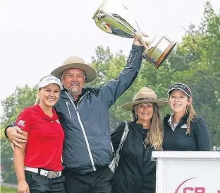  ?? GETTY IMAGES ?? Brooke Henderson of Canada with the champions trophy and her dad, Dave, mother, Darlene and sister & caddie, Brittany, following the final round of the CP Womens Open at the Wascana Country Club on Aug. 26, 2018, in Regina.