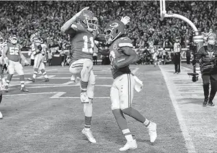  ?? Colin E. Braley / Associated Press ?? Chiefs wide receiver Byron Pringle, right, celebrates with teammate Demarcus Robinson after catching a 2-yard touchdown pass during the second half of Sunday night’s rout of the Steelers.