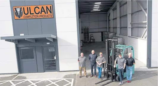  ??  ?? EXPANSION: Vulcan Completion Products team outside new warehouse are, from left, Neil Goodall, Ivan Bradbury, Andy Kirk, Nathan Kirk and Ian Kirk