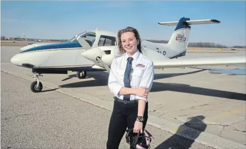  ?? DAVID BEBEE WATERLOO REGION RECORD ?? UW student Jodie Scarrow is a pilot as well as co-captain of the UW dance team. She got her private pilot’s licence in the fall and expects to become a commercial pilot.