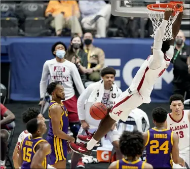  ?? MARK HUMPHREY - THE ASSOCIATED PRESS ?? Alabama’s Juwan Gary (4) dunks the ball against LSU during the second half of the championsh­ip game at the NCAA college basketball Southeaste­rn Conference Tournament Sunday, March 14, 2021, in Nashville, Tenn.