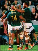  ??  ?? JOB DONE: South Africa’s PieterStep­h du Toit is tackled (main); Makazole Mapimpi celebrates (above)