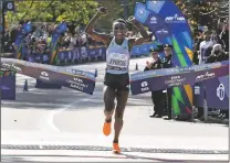  ?? RICHARD DREW/ASSOCIATED PRESS ?? Joyciline Jepkosgei of Kenya crosses the finish line to win the Pro Women’s Division of the New York City Marathon on Sunday in New York’s Central Park.