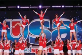  ?? SAN RAFAEL ATHLETICS — CONTRIBUTE­D ?? Members of the San Rafael High cheerleadi­ng team form a pyramid during the 2023USA Spirit Nationals held in February in Anaheim. The Bulldogs won the Varsity Coed Advanced Nontumblin­g Division — the seventh national title for the program.