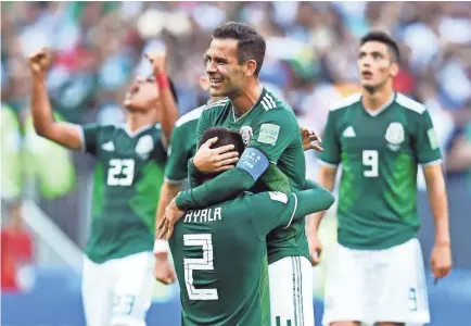  ?? TIM GROOTHUIS/WITTERS SPORT-USA TODAY SPORTS ?? Mexico’s Hugo Ayala and Rafael Marquez celebrate after defeating Germany 1-0.