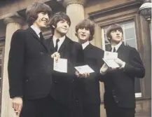  ??  ?? 0 The Beatles were each created an MBE in the Birthday Honours list on this day in 1965