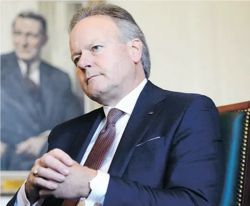  ?? SEAN KILPATRICK / THE CANADIAN PRESS ?? Stephen Poloz, Governor of the Bank of Canada, takes part in an interview Wednesday at the Bank of Canada in Ottawa. A painted portrait of James Elliott Coyne who was governor from 1955-1961 hangs in the background.