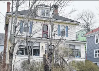  ?? ADAM MACINNIS/THE NEWS ?? The owners of this home on George Street in New Glasgow successful­ly proved that damage to the building was caused by demolition of the neighbouri­ng school and constructi­on of a new one.