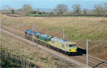  ?? Brad Joyce ?? GB Railfreigh­t’s 66763 passes Searchligh­t Lane hauling the replacemen­t 66734 and 69004, working 0Z35 from Hams Hall to Longport on January 17, 2022. Both 66734 and 69004 are yet to be repainted into GBRF colours.