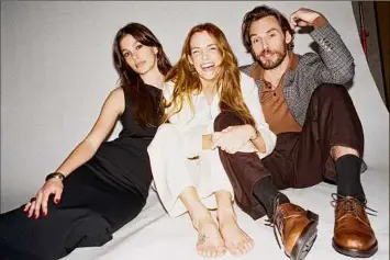  ?? Chantal Anderson / The New York Times ?? Riley Keough, center, is seen with her “Daisy Jones & the Six” costars, Camila Morrone and Sam Claflin, in Los Angeles, on Feb. 9.