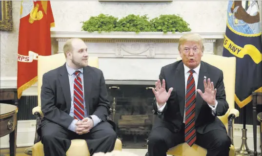  ?? Alex Brandon The Associated Press ?? President Donald Trump talks as Joshua Holt, who was released from a prison in Venezuela, joins him Saturday at the White House.