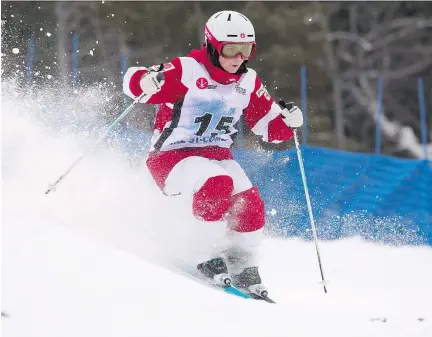  ?? JACQUES BOISSINOT/THE CANADIAN PRESS ?? Andi Naude, of Penticton, B.C., races in the freestyle moguls World Cup event on Jan. 21 in Val St-Come, Que. Naude finished second, with two of the Dufour-Lapointe sisters — Justine and Chloe — joining her in a Canadian sweep of the podium.