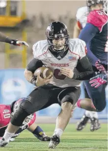  ?? | RICK OSENTOSKI/AP ?? Northern Illinois quarterbac­k Jordan Lynch ran for three second-half touchdowns Wednesday against Toledo to keep the Huskies unbeaten.