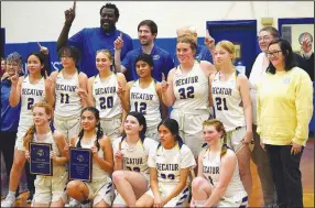  ?? Ricky Thor/Submitted ?? The 2022-23 Decatur Lady Bulldog junior high basketball team proudly displays the two titles the team received after winning the 1A-1 district tournament at St. Paul on Feb. 11. The team, coached by Fess Thompson, went undefeated, which earned it the regular season conference championsh­ip as well as the district championsh­ip.