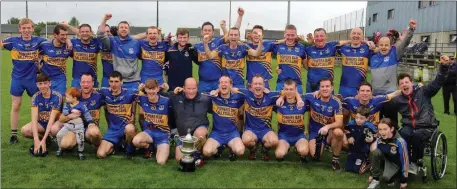  ??  ?? The jubilant Gusserane squad with manager Michael Hennessy (front row, extreme right).
