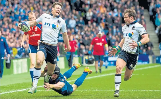  ?? Picture: SNS ?? CATCH ME IF YOU CAN: Scotland’s Duncan Taylor evades a despairing French tackle to storm over the line on a great day for Vern Cotter’s side.