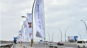  ??  ?? Flags decorate the Dubai Water Canal Bridge as part of the RTA’s response to Sheikh Mohammed bin Rashid’s call to thank Sheikh Mohamed bin Zayed for complement­ing UAE’s developmen­t drive.