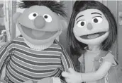  ?? NOREEN NASIR/AP ?? Ernie, a muppet, appears with new character Ji-Young Nov. 1 on the set of “Sesame Street” in New York.