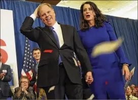  ?? JOHN BAZEMORE / ASSOCIATED PRESS ?? Doug Jones and his wife, Louise, greet supporters Tuesday at an election-night party in Birmingham, Ala. Jones, a Democrat running for the U.S. Senate, defeated Republican opponent Roy Moore in the special election.