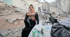  ?? | Reuters ?? A WOMAN reacts as she inspects damage at Al Shifa Hospital after Israeli forces withdrew from the hospital and the area around it following a two-week operation, amid the IsraelHama­s conflict, in Gaza City yesterday.