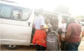  ?? ?? The trafficked children boarding a vehicle to return to their parents