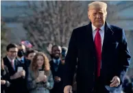  ?? AFP ?? President Trump walks outside the White House on Tuesday in Washington before his departure to Alamo, Texas. —