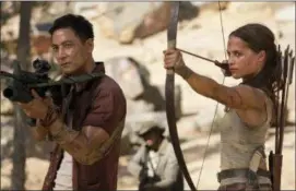  ?? ILZE KITSHOFF — WARNER BROS. PICTURES VIA AP, FILE ?? This file image released by Warner Bros. Pictures shows Daniel Wu, left, and Alicia Vikander in a scene from “Tomb Raider.”